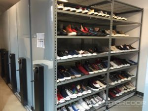Mechnical-assist mobile shelving for high-density shoe storage for Converse. Shown with wire shelves.